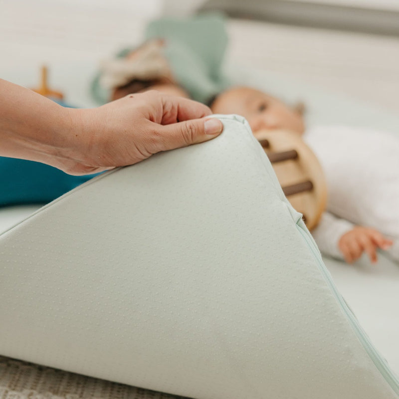 Hand lifting the thick natural latex Play Mat